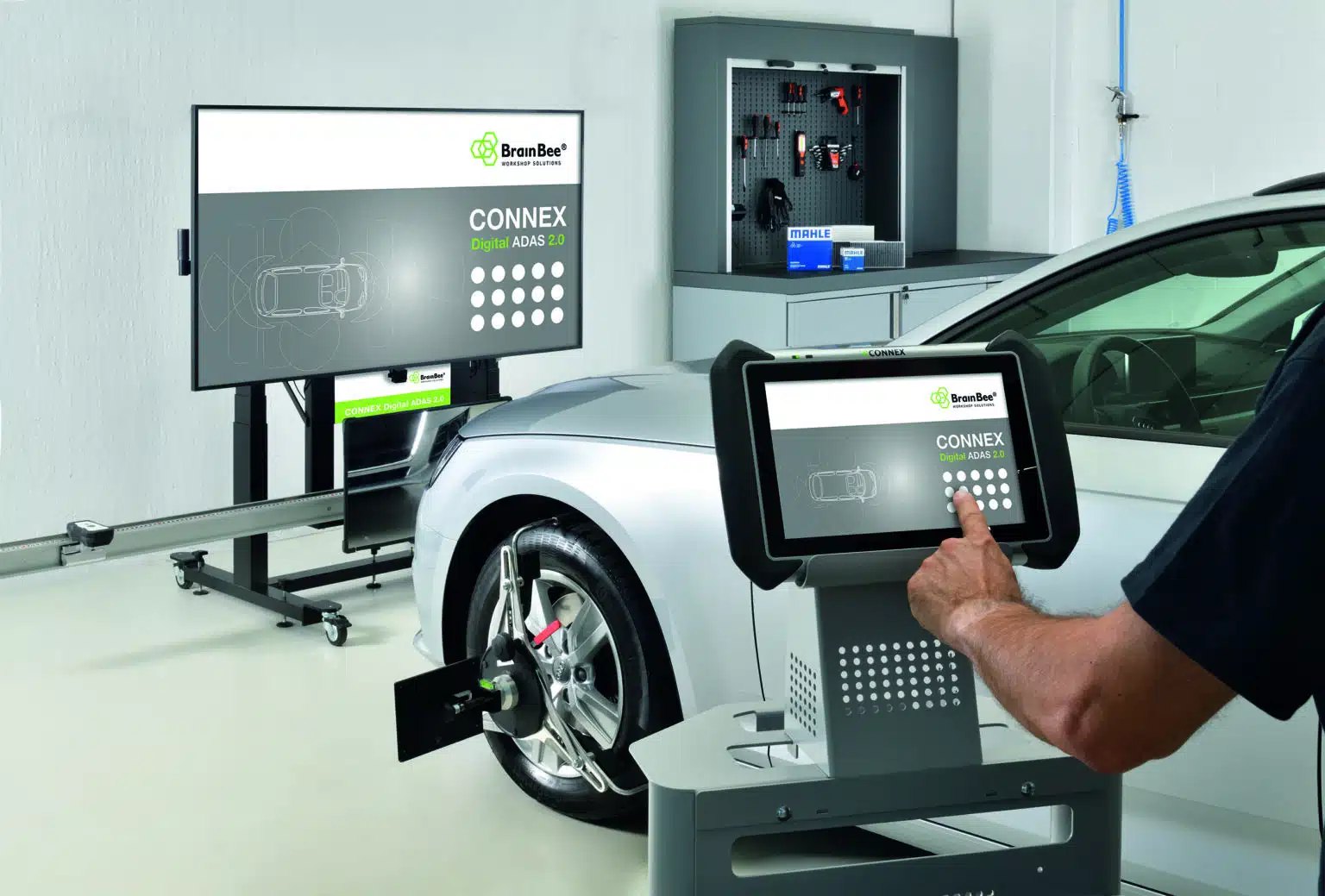 Unbranded vehicle centred in an ADAS calibration bay